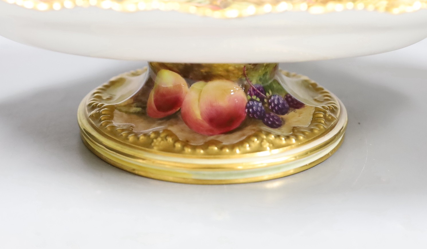 A Royal Worcester fruit painted footed dish, c. 1930, by T. Lockyer. 32cm wide